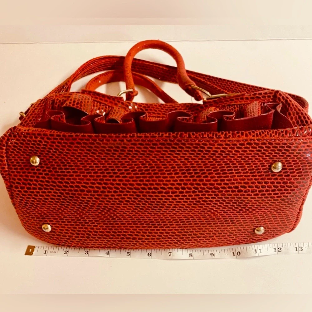 Mellow World-Red Ruffle Maximalist shoulder bag with snake print & extra strap.